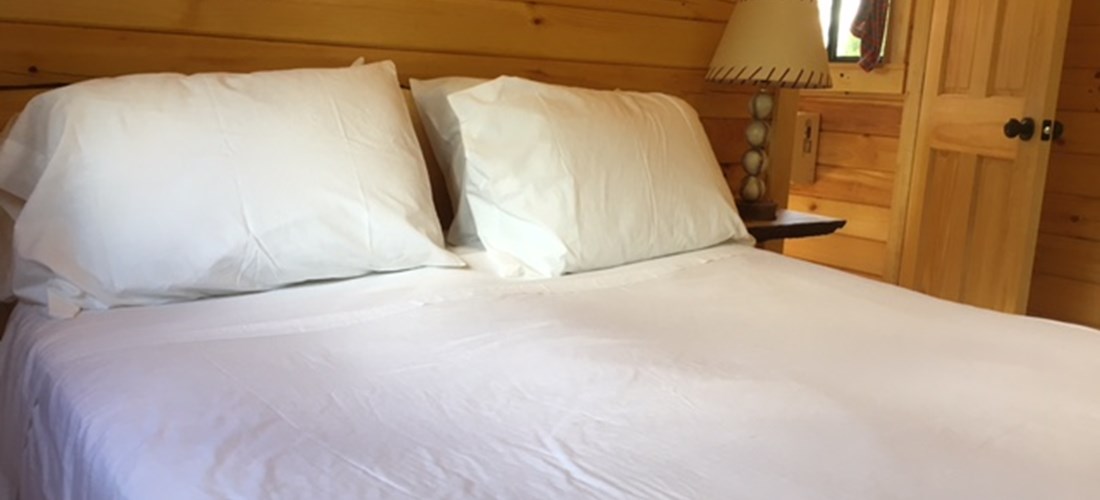 Queen bed in Deluxe Cabin