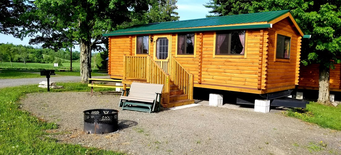 Deluxe log lodges sleep up to 6. Bed & bath linens provided.