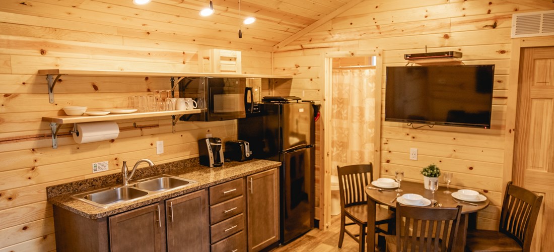 Kitchen - Coshocton KOA Deluxe Cabin in the Woods