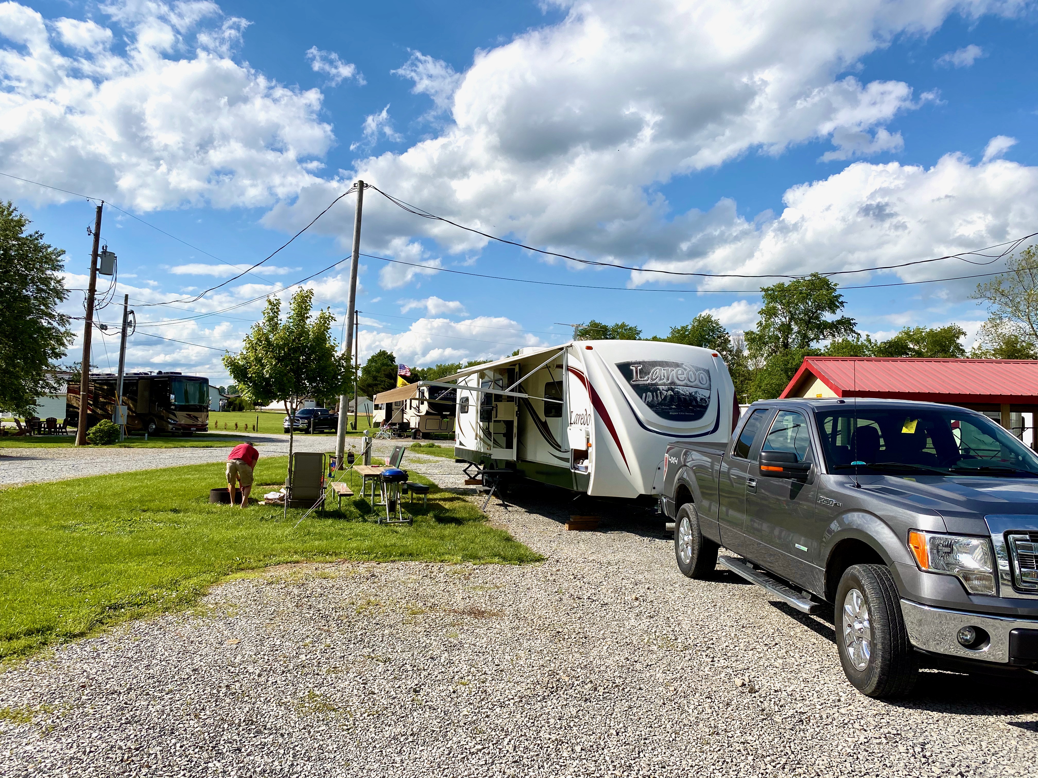 Nice and level pull-through & full hook-up RV site at Coshocton KOA.