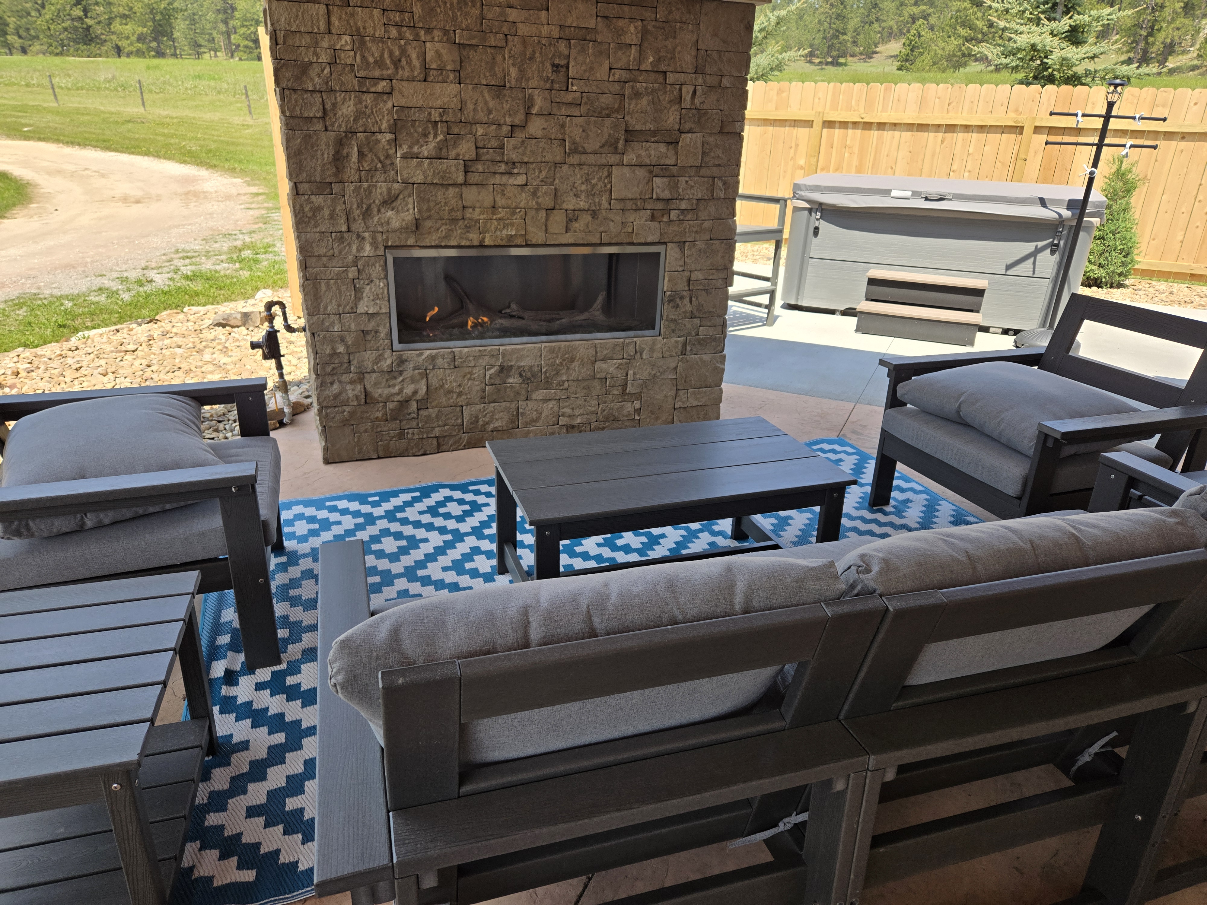 Enjoy the outdoor fireplace and lounge