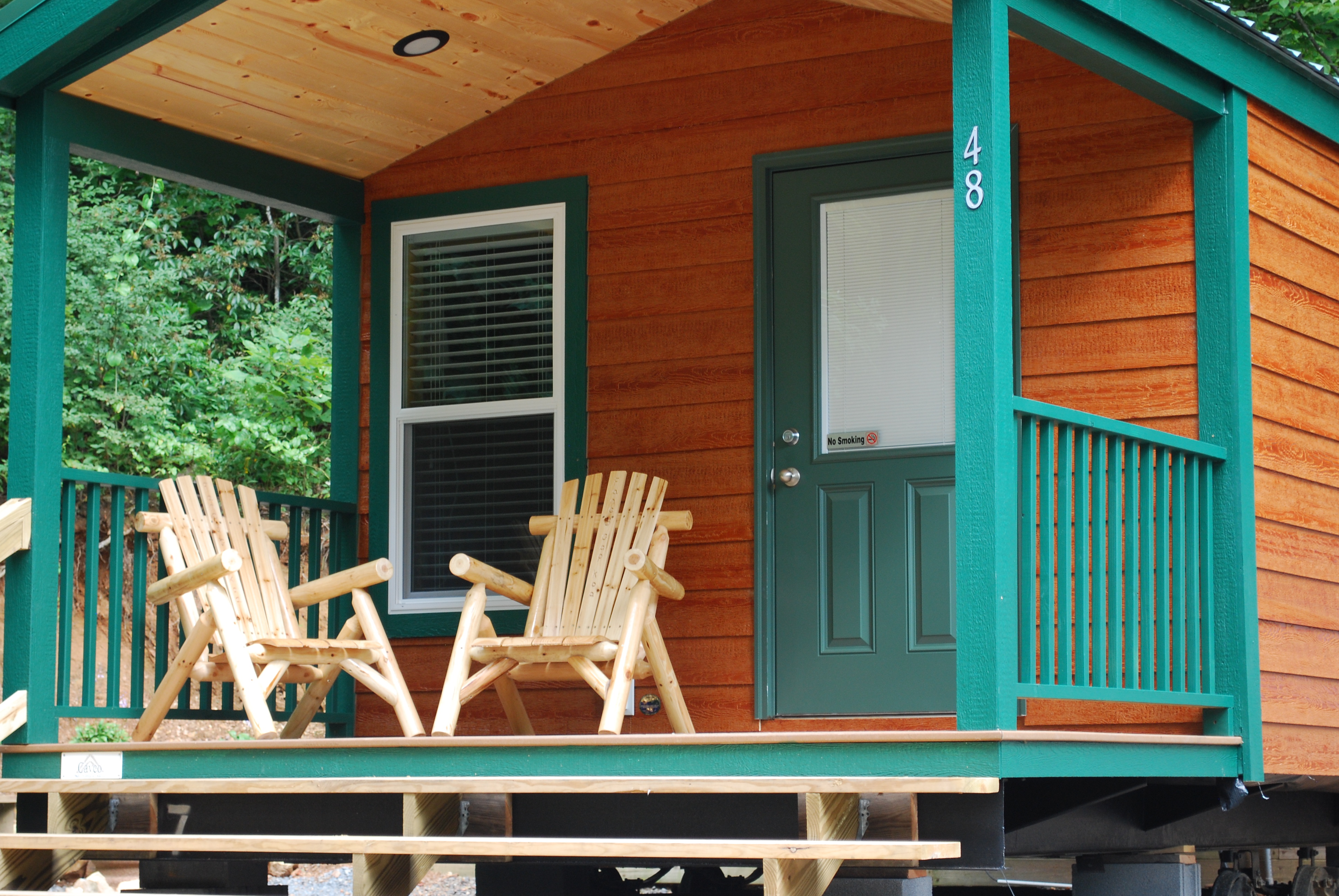 Enjoy the porch and the 1/2 bath. Sites 48, 49, 50