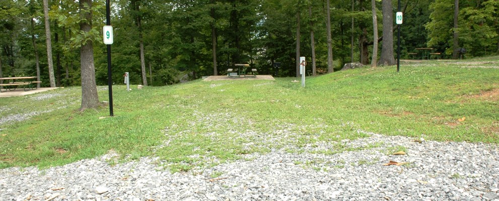 This back-in site is located in the Hickory knoll section of our campground.   It offers shade from the trees surrounding and it and is great for those who like a cool relaxing stay.