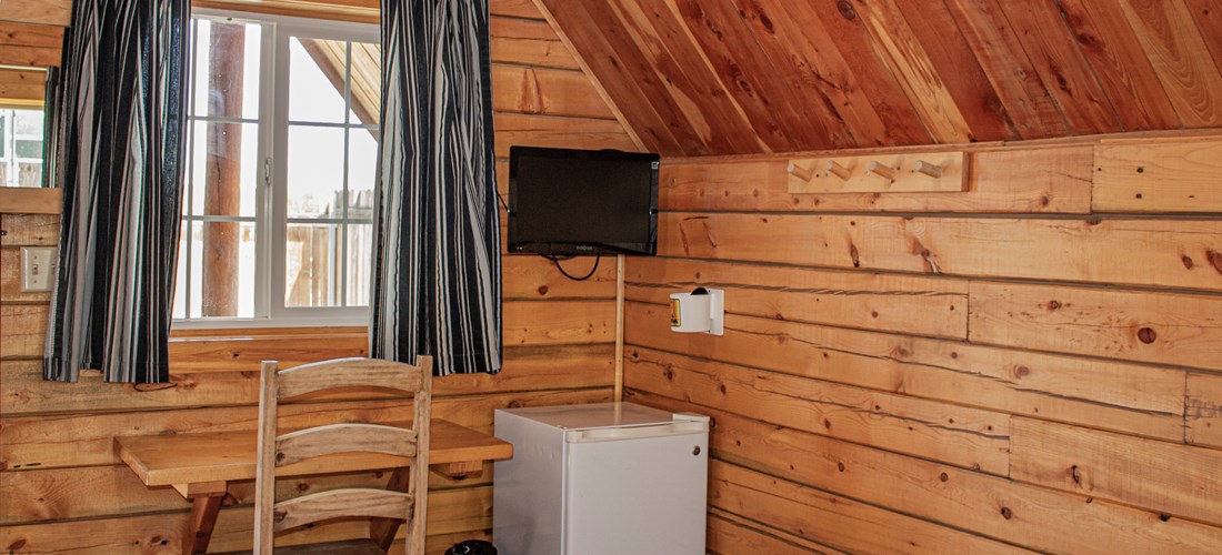 Camping Cabins are stocked with a mini fridge, cable television, air conditioner, and heaters.