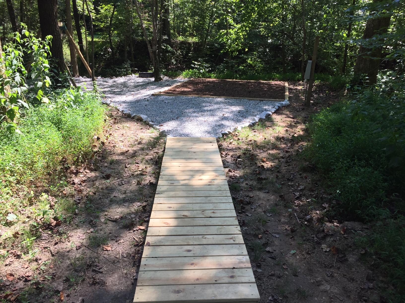 Walk way out to Peninsula on Site 38 Premium Deluxe KOA Patio