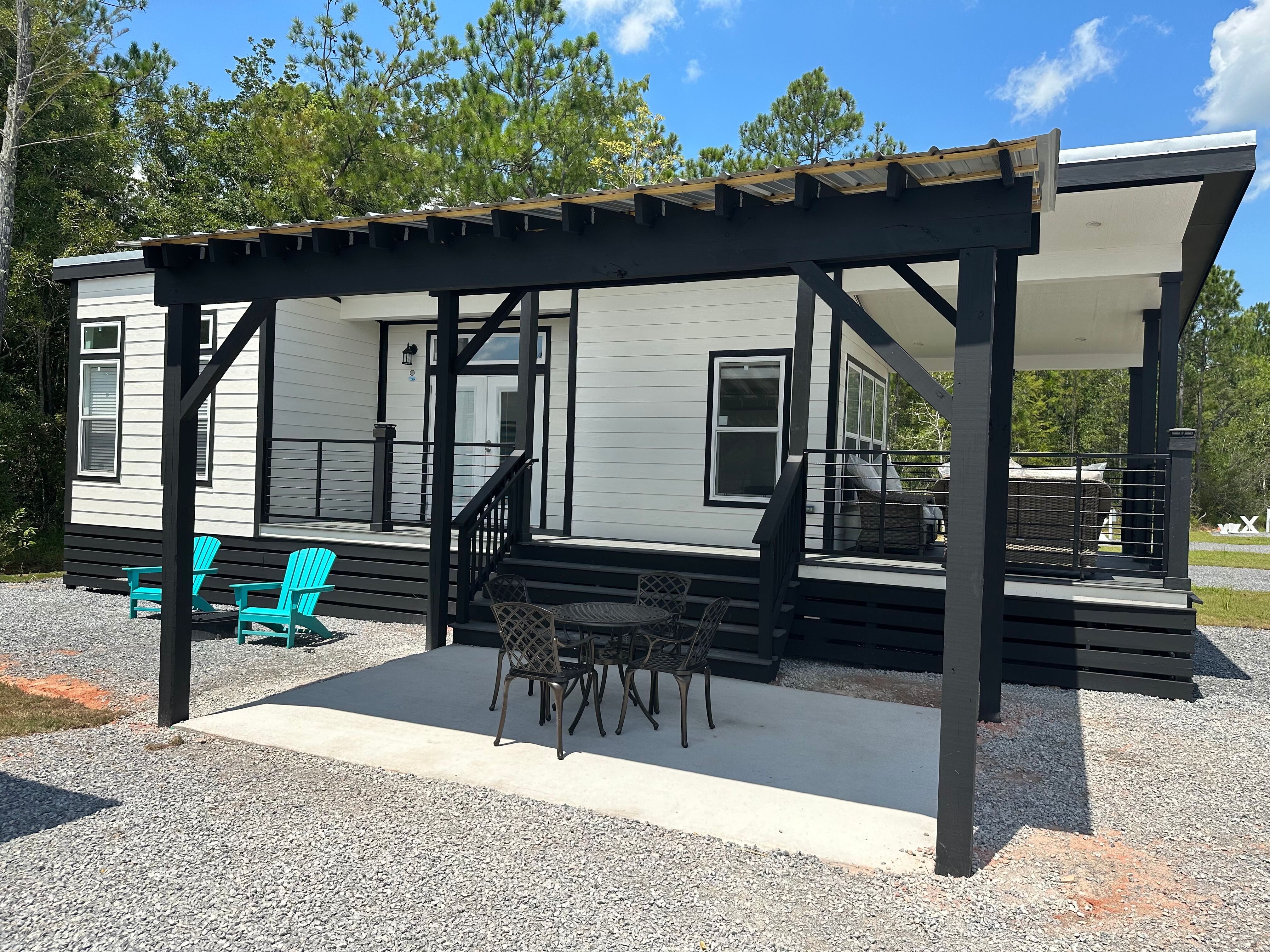 Deluxe Cabin (Full Bath with Shower), KOA Patio ® Pictures Gulfport