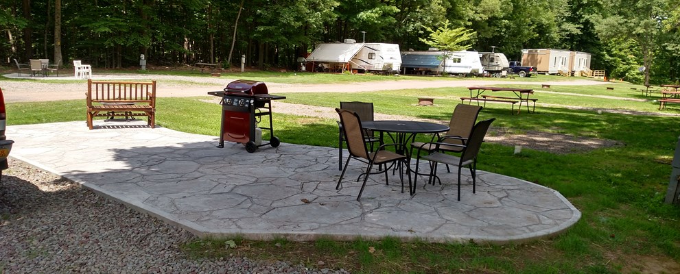 Deluxe Patio Pull Thru site.  patio furniture, fire feature, and gas grill.