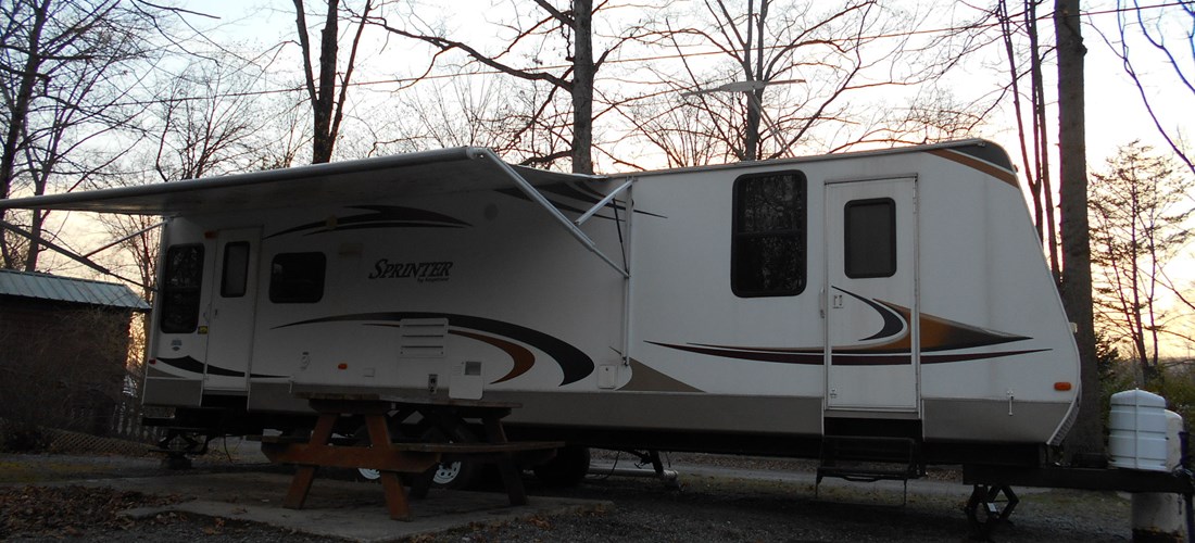 Our Rental RV is situated on a creekside site.