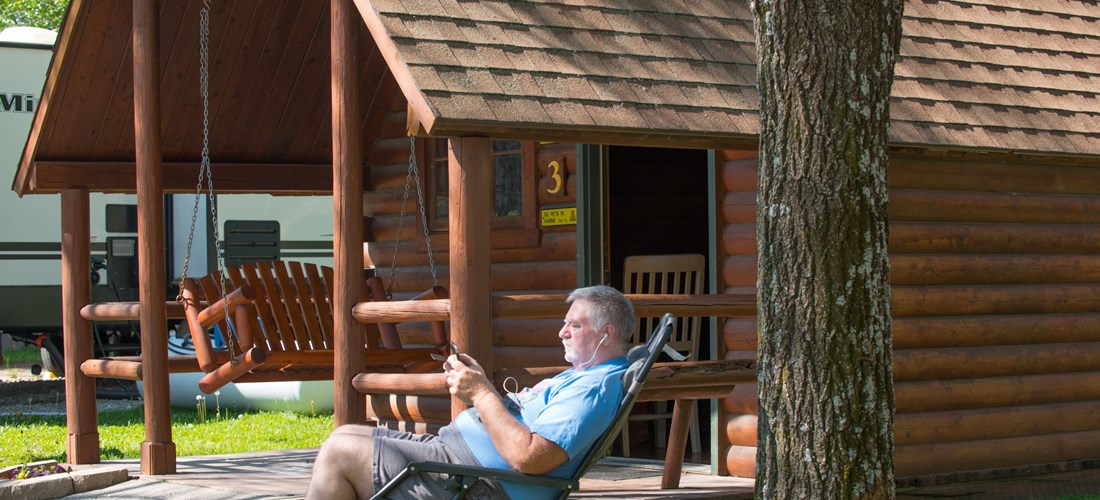 A man enjoying his camping cabin