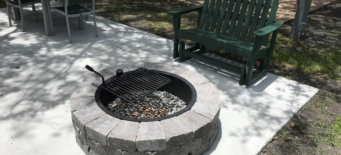 Tent Fire pit w/ cooking grate, glider and patio furniture