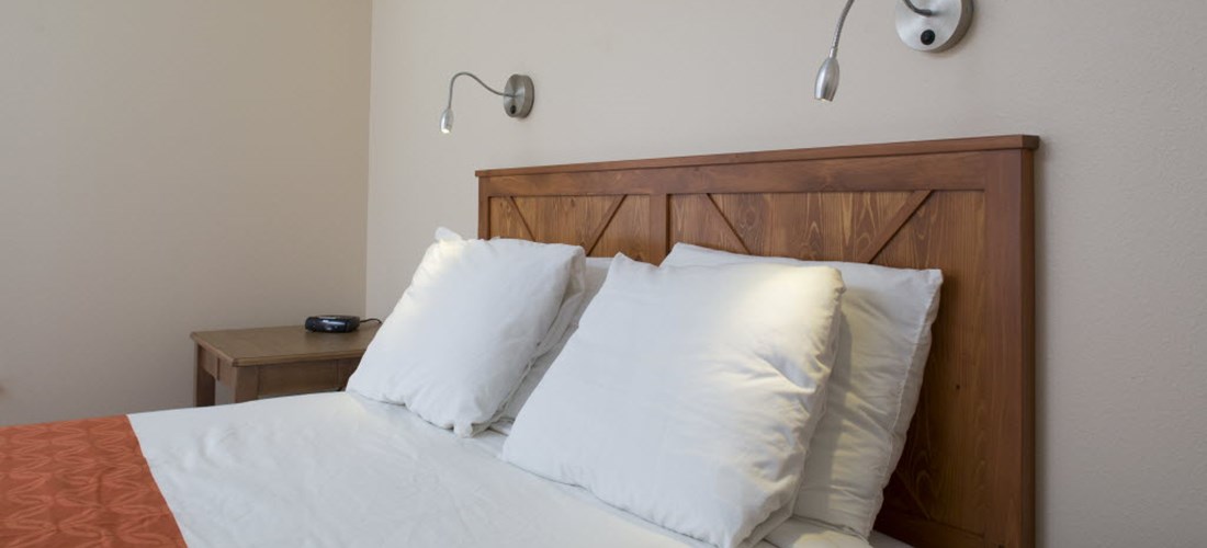 Queen bed in Deluxe Cabin