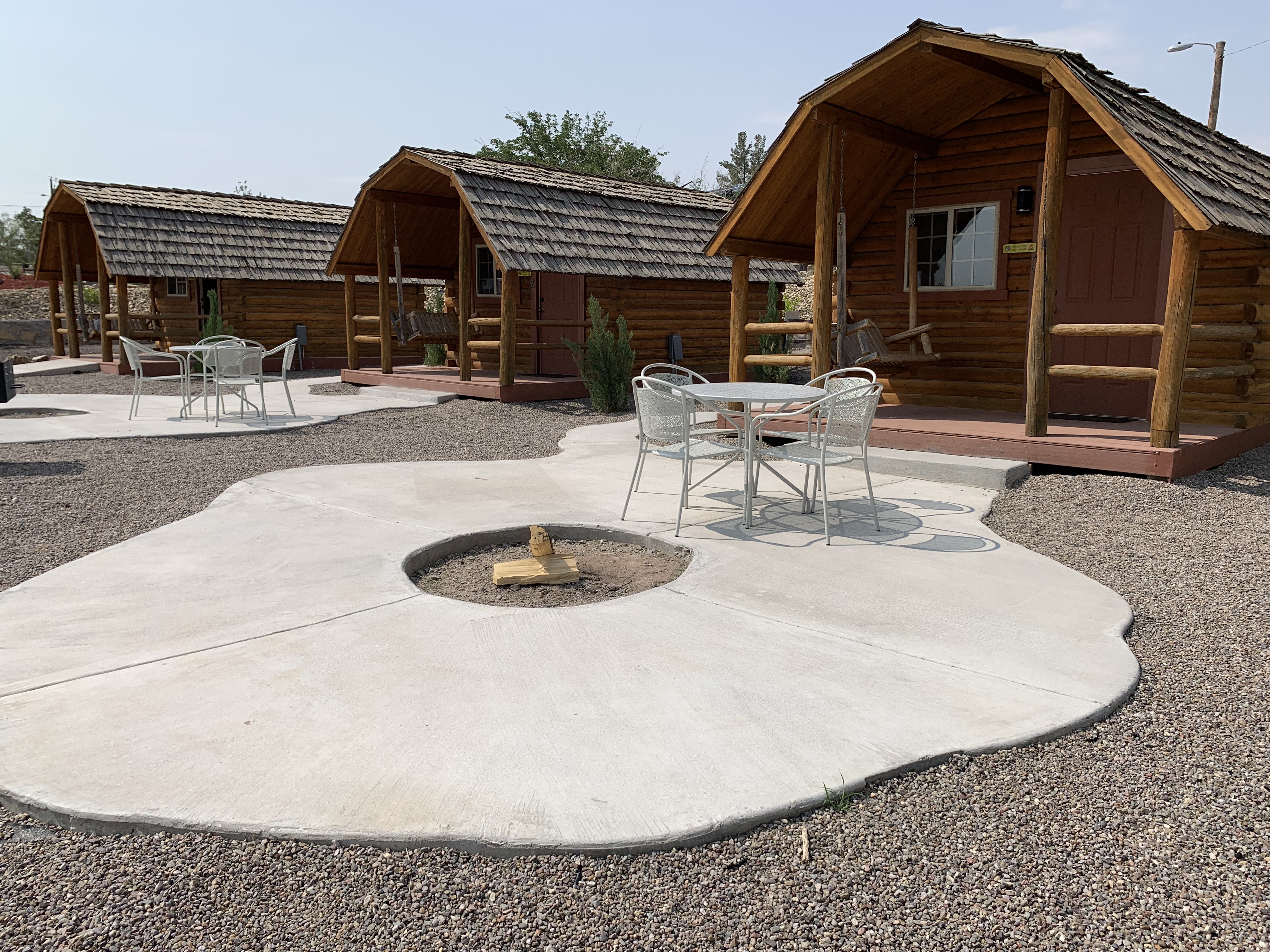 Private Patio with Fire Pit and Table and Chairs Available at Each Cabin