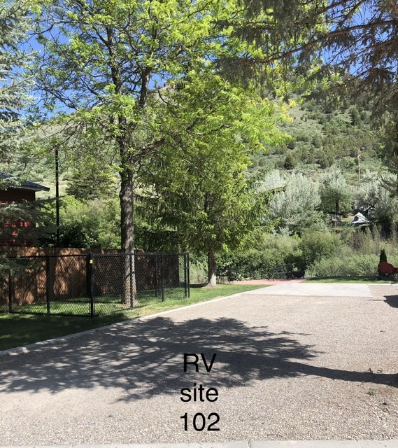 RV site 102 full hook up back in with paw pen and patio.