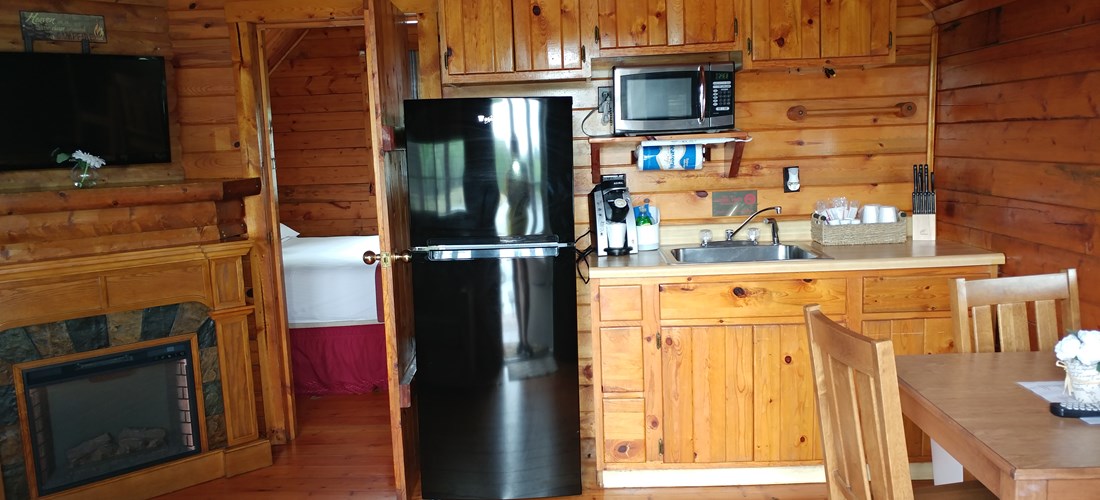 The Cottage - K27 - Is a perfect selection for 2 people.  This unit features a queen bed, full bath with shower, electric fireplace and kitchenette.   Outside is a large deck overlooking the lake.
