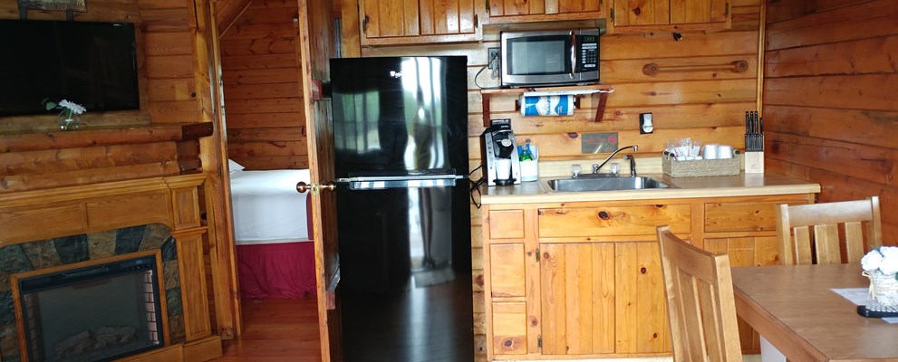 The Cottage - K27 - Is a perfect selection for 2 people.  This unit features a queen bed, full bath with shower, electric fireplace and kitchenette.   Outside is a large deck overlooking the lake.