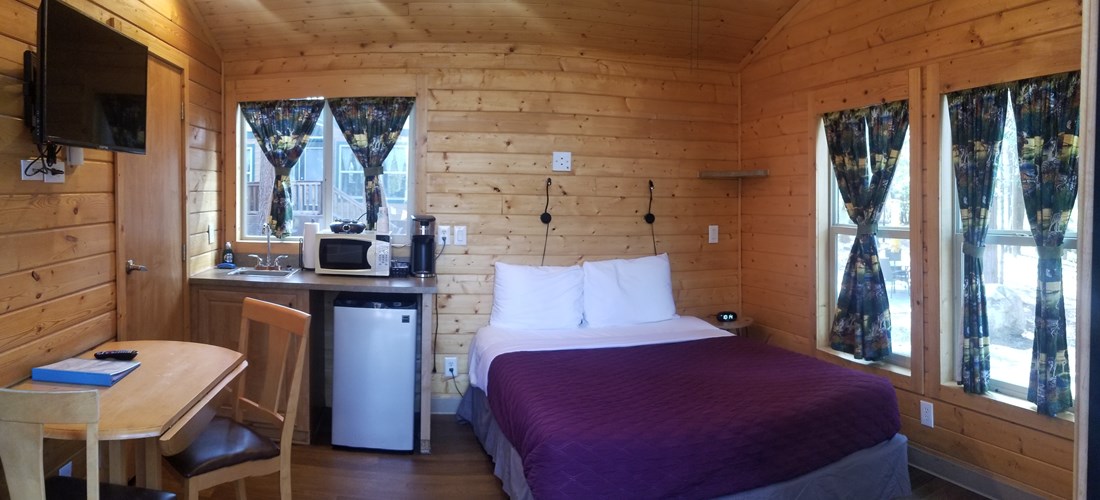 K5 & K6 Deluxe Cottages Sleeps up to 4 people. All linens, towels, and coffee provided. Includes a concrete picnic table and a fire ring with a flip top grill on the fire ring to cook on.