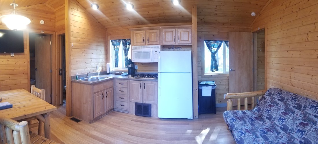 K7 & K8 Deluxe Lodge Cabin that sleeps up to 6 people. Comes with concrete picnic table, concrete patio with table, chairs, umbrella, fire ring and propane BBQ grill. All linens, towels, coffee provided. Also has a Roku TV which has Live TV and online TV streaming services.