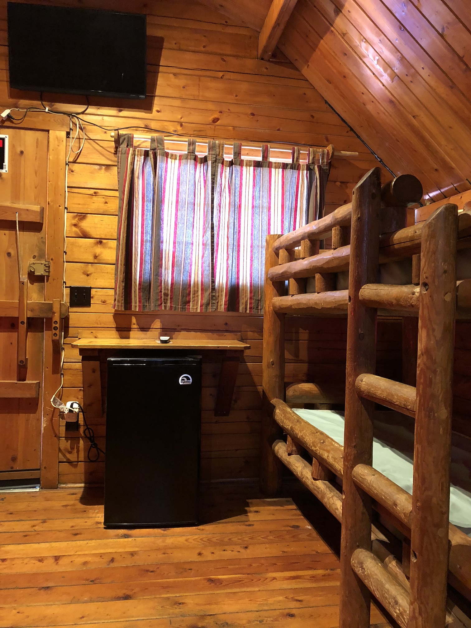 The 2 bedroom cabins have 2 sets of bunk beds in the front room as well as cable TV and a mini-fridge.