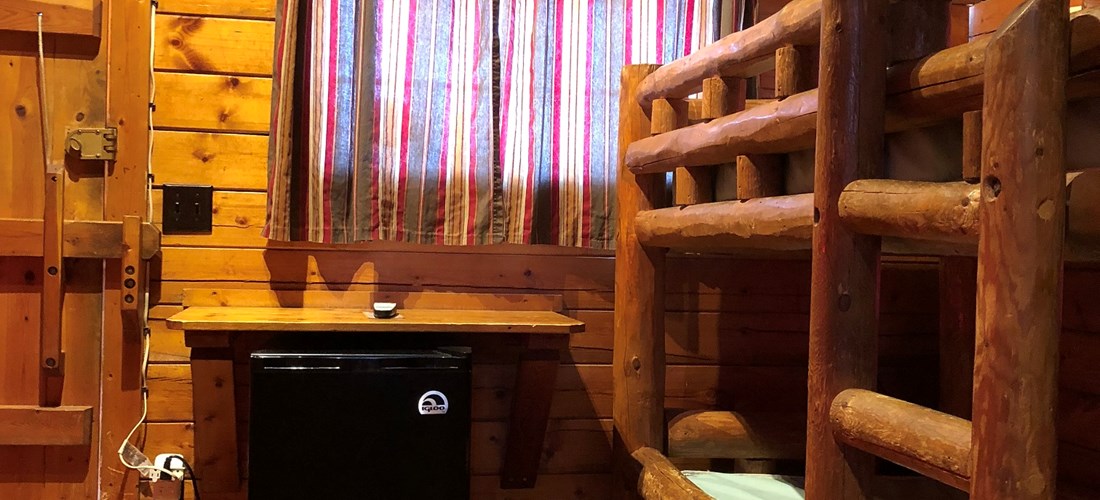 The 2 bedroom cabins have 2 sets of bunk beds in the front room as well as cable TV and a mini-fridge.