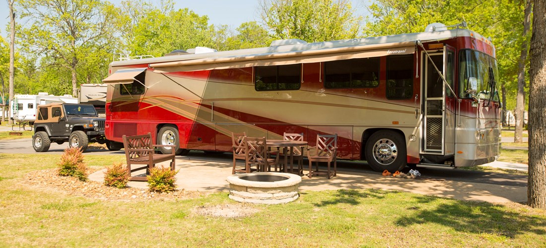 Deluxe patio sites with a fire pit, bench glider, and premium patio furniture make this glamping experience truly wonderful.