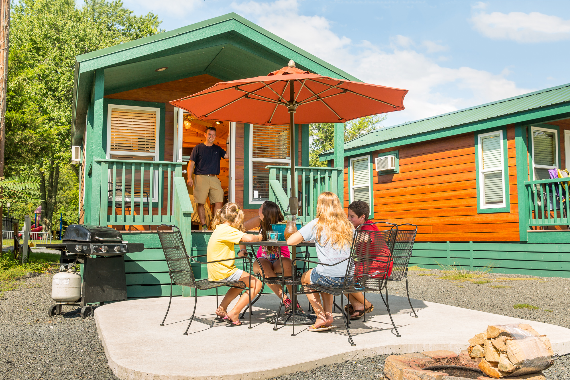 Enjoying Lunch Around The Picnic Table. Waterfront Studio Cabin With Patio. Sleeps 4.