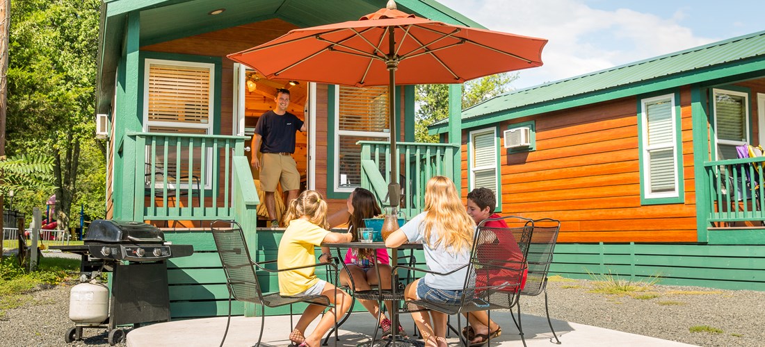 Enjoying Lunch Around The Picnic Table. Waterfront Studio Cabin With Patio. Sleeps 4.