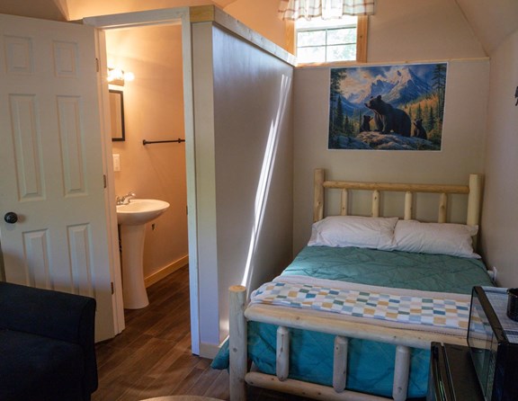 Cozy Camping Cabin with Half bath.  Linens not included.
