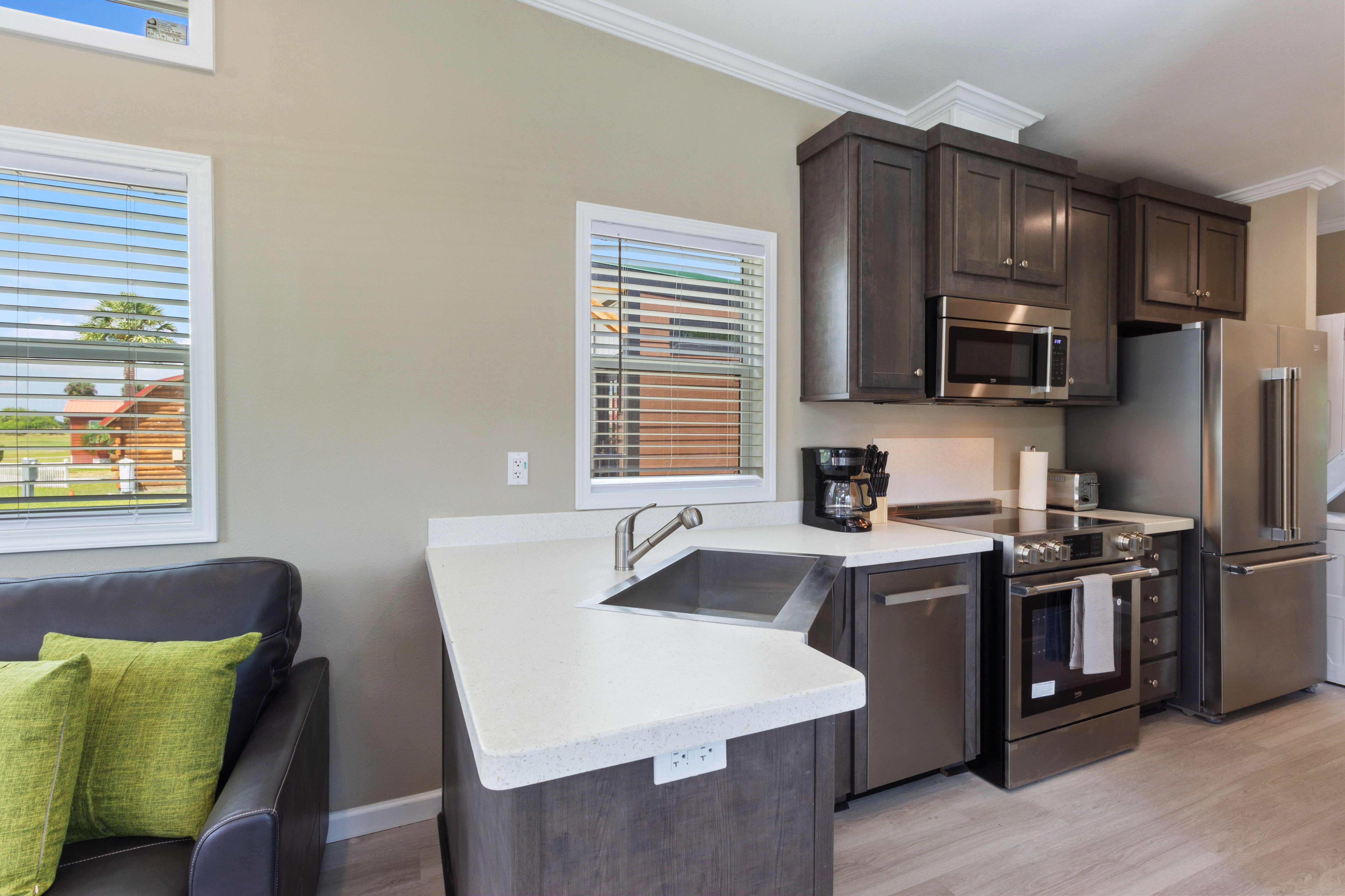 Kitchen with sink, microwave, oven and stovetop