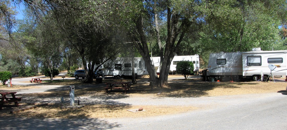 This unique full hookup 30 amp pull thru site is known for it's very large sized picnic area giving families plenty of space. It features a picnic table, bbq grill, wifi access, and HD cable tv. Pictured is site 44.