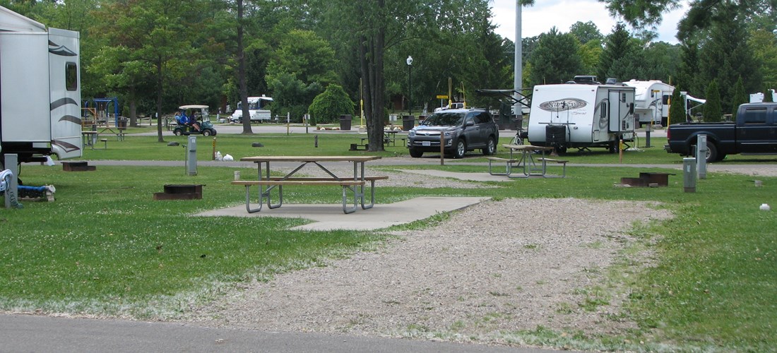 Deluxe site. Park on gravel with a cement patio.