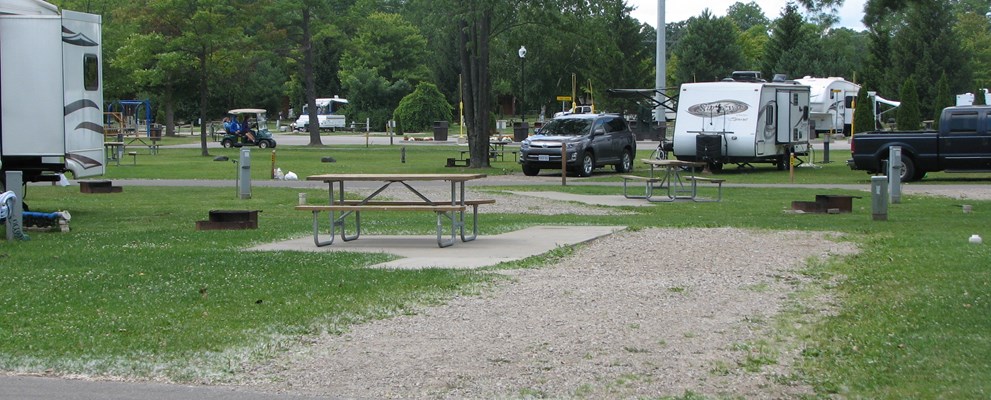 Deluxe site. Park on gravel with a cement patio.