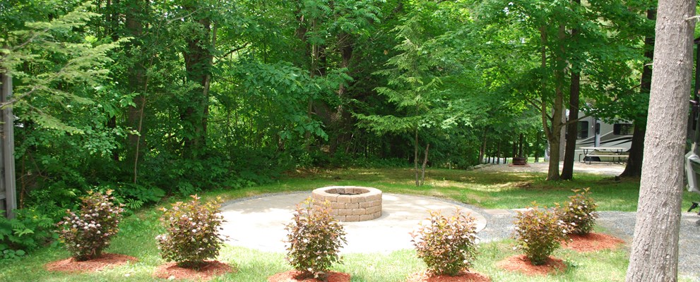 Beautiful view from your front window! Circular pavered patio with deluxe stone firepit.