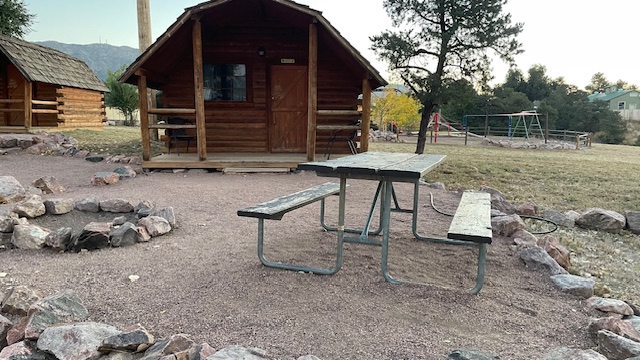 exterior of a cabin with sitting outside