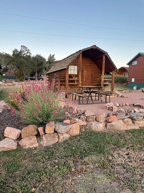 exterior of a cabin with sitting outside