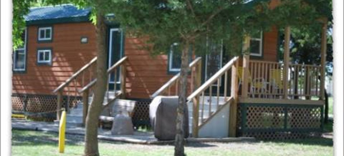 Camping Lodge 2  with comforts of home full kitchen and bath, TV, front porch with glider, firepit and grill bedding and towels provided, Sleeps 8 . NO PETS ALLOWED