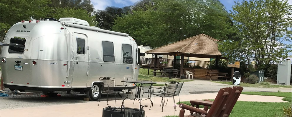 50amp pull thru patio sites have beautiful stamped concrete patio, furniture, firepit, free wifi and concierge septic pumping.  These huge pull thru sites are campers favorites and sell out quick.