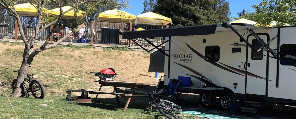 Brand new 50 amp back in RV sites in the Valley View area feature Direct TV cable, picnic table , fire ring and daily concierge septic pumping.  The camping kitchen and bathrooms and showers are close by.