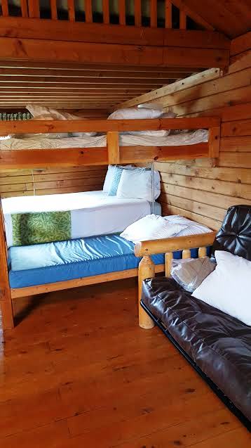 Log double bed and bunkbed downstairs