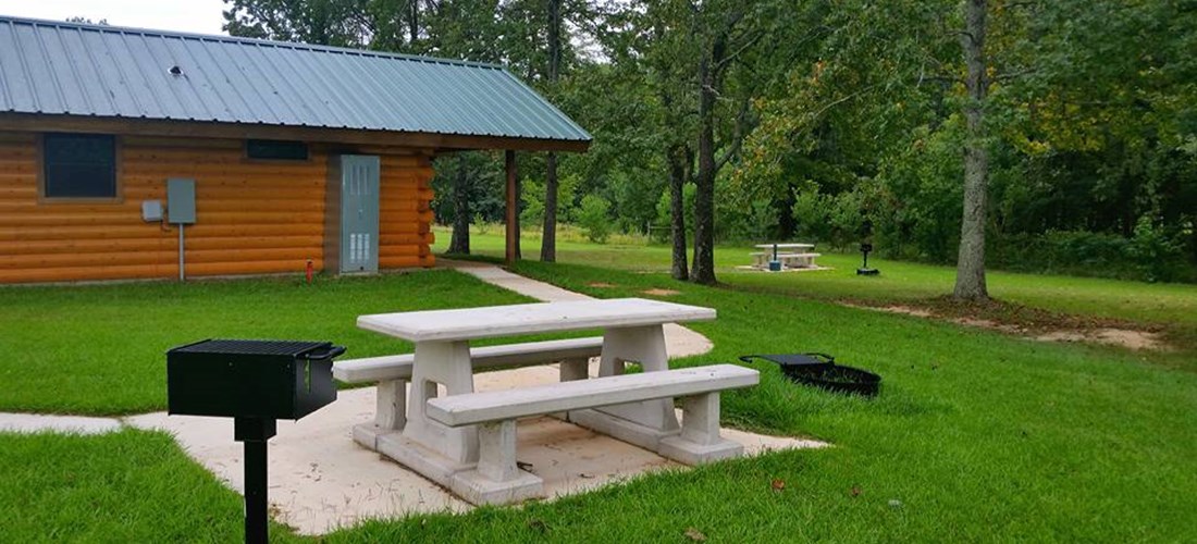 Each of our 1-bedroom log cabins has its own private picnic table, grill, and fire ring.