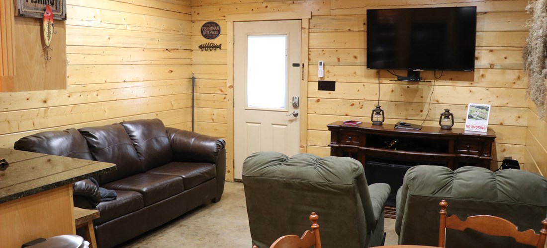 Our luxury log cabins offer a living area complete with an electric fireplace, Cable TV, and various furniture to make our guests feel at home.  Each cabin's furniture will vary slightly.