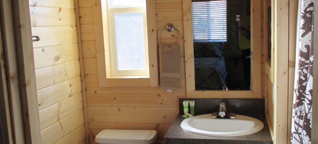 Freshen up &  Enjoy the Deluxe Camping Experience in this Cabin!