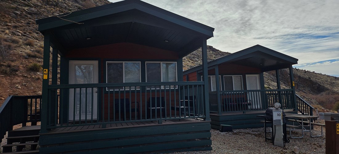 Deluxe Family Lodges nestled into the hillside have views of Red Cliffs Recreation Area