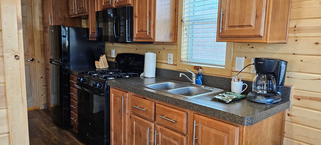 Deluxe Family Lodge Full Kitchen with appliances, cookware, and dishes for up to 6 people