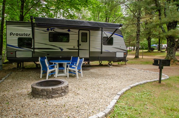 Gather around the fire pit at one of our RV rentals