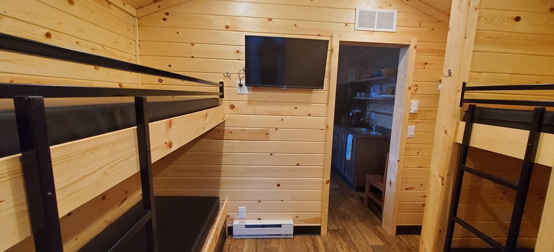 Double bunk room with Roku TV and half bathroom