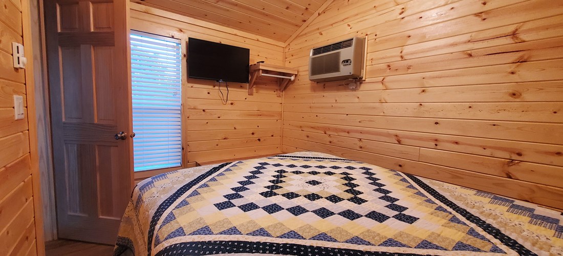 Master bedroom with Roku TV and A/C