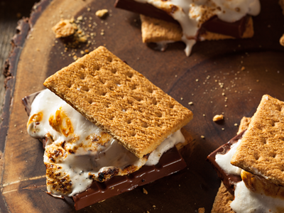 Freshly made s'mores with roasted marshmallows and melted chocolate on graham crackers at Valdez KOA Journey.