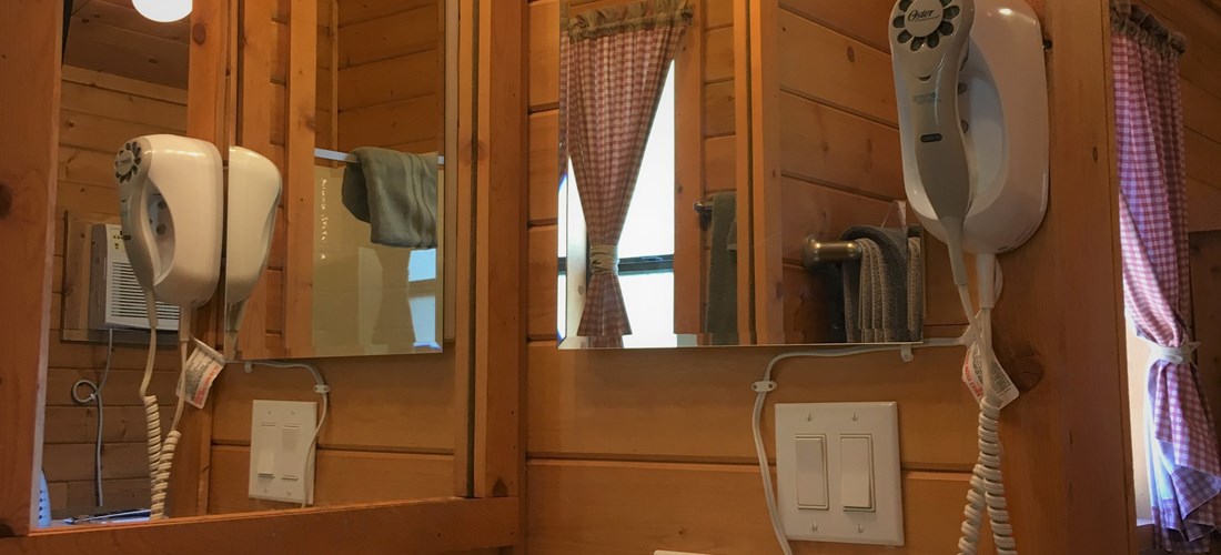 Private bathroom inside cabin with hairdryer for your convenience.
