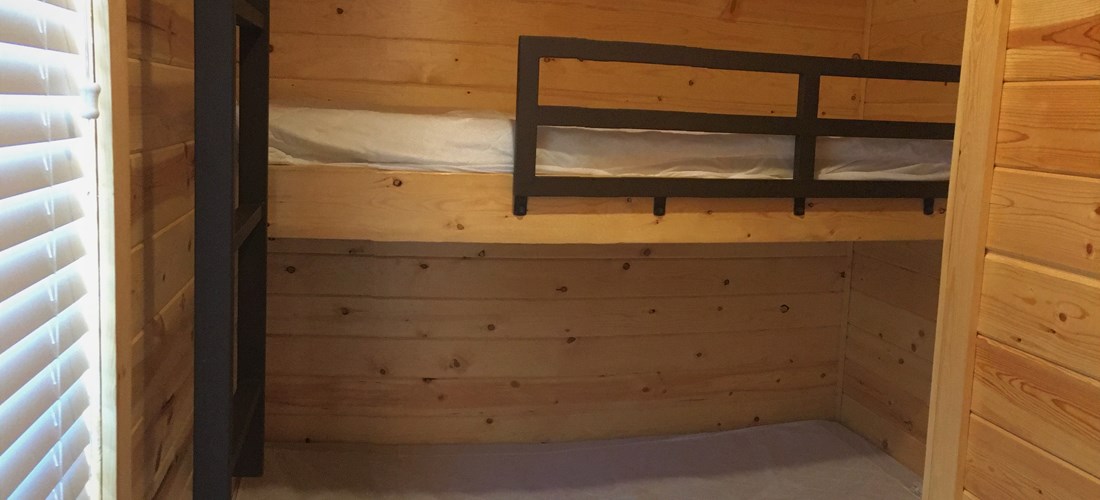 Bunk beds with full and twin bed in separate room with own heater.