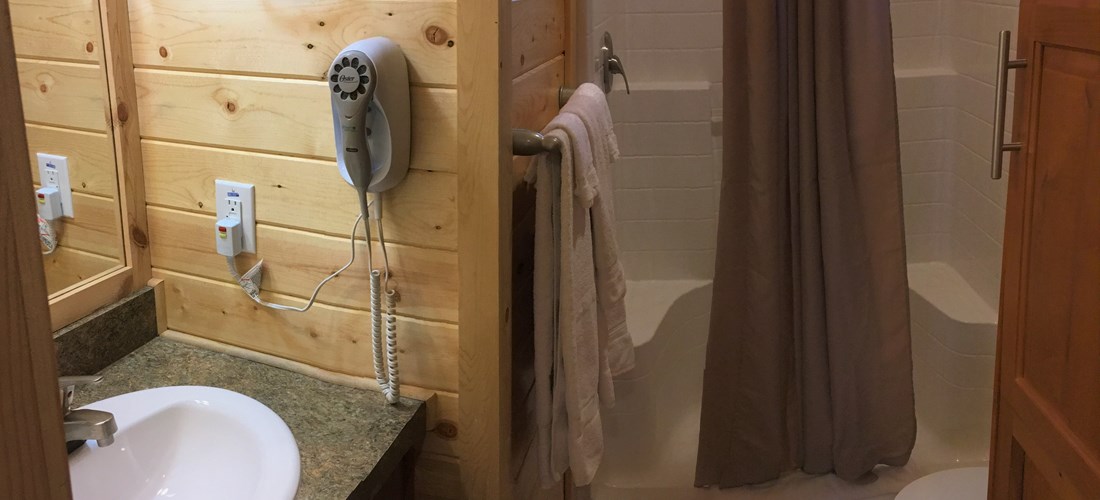 Convenient in-cabin bathroom with hairdryer, towels and shampoo/soap provided.